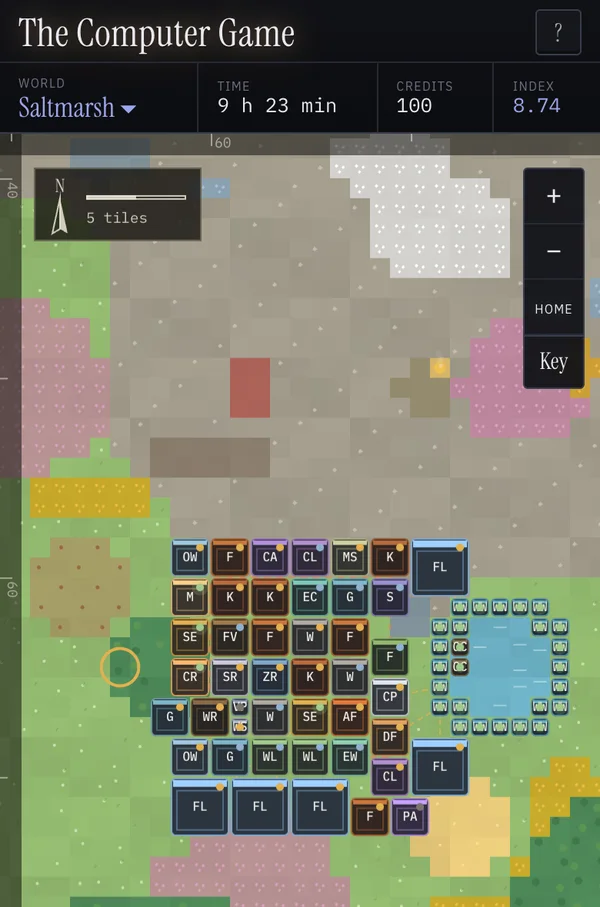 A world in The Computer Game on a phone: a survey map of grassland, forest, stone and water, with a block of workshops, kilns, furnaces and fab lines.